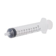 A white syringe with a tapered tip.