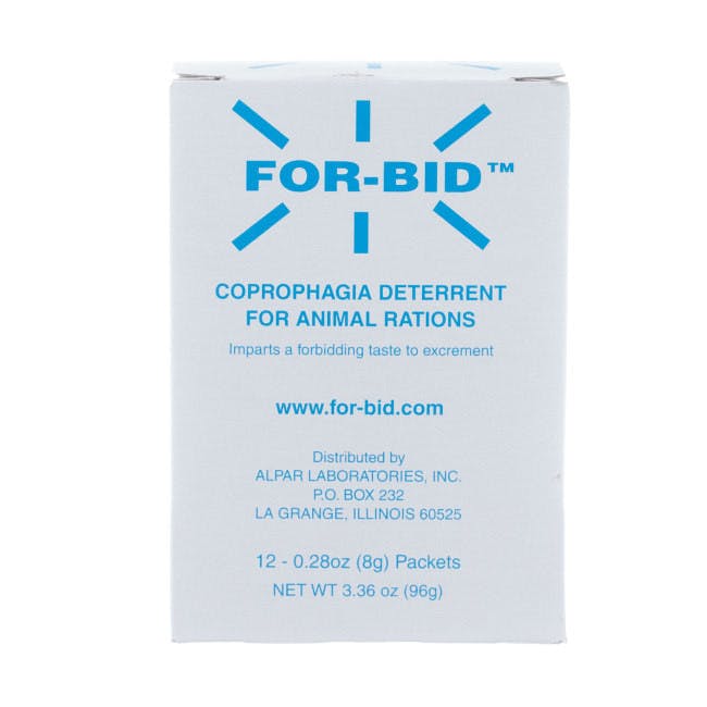 A white box with blue writing on it says "FOR-BID" with blue lines pointing outward. It's Coprophagia Deterrent for pets.