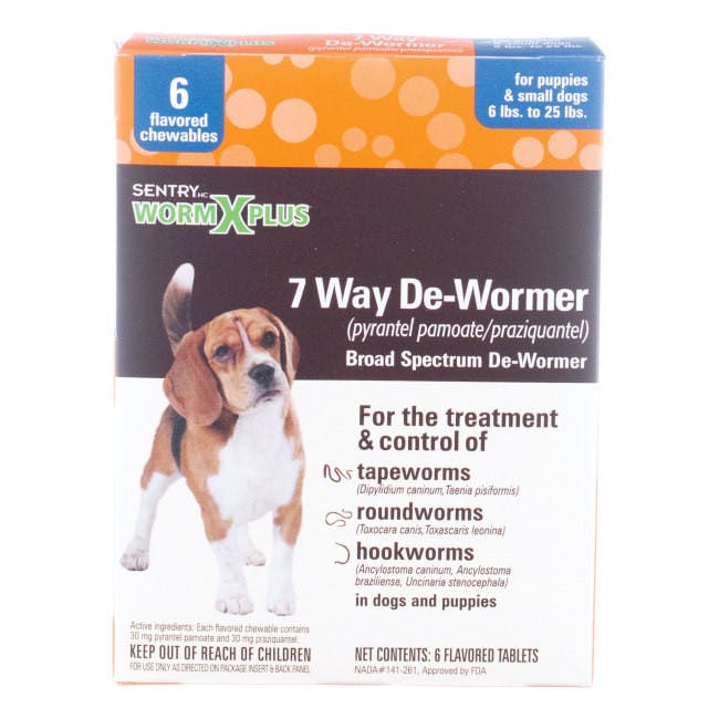 A brown, orange & white box has an image of a dog on it. It says "7 Way De-Wormer", for tapeworms, roundworms, & hookworms.