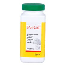 A white bottle has a green cap with a red and yellow label. It says "Pet-Cal". It contains a supplement for dogs.